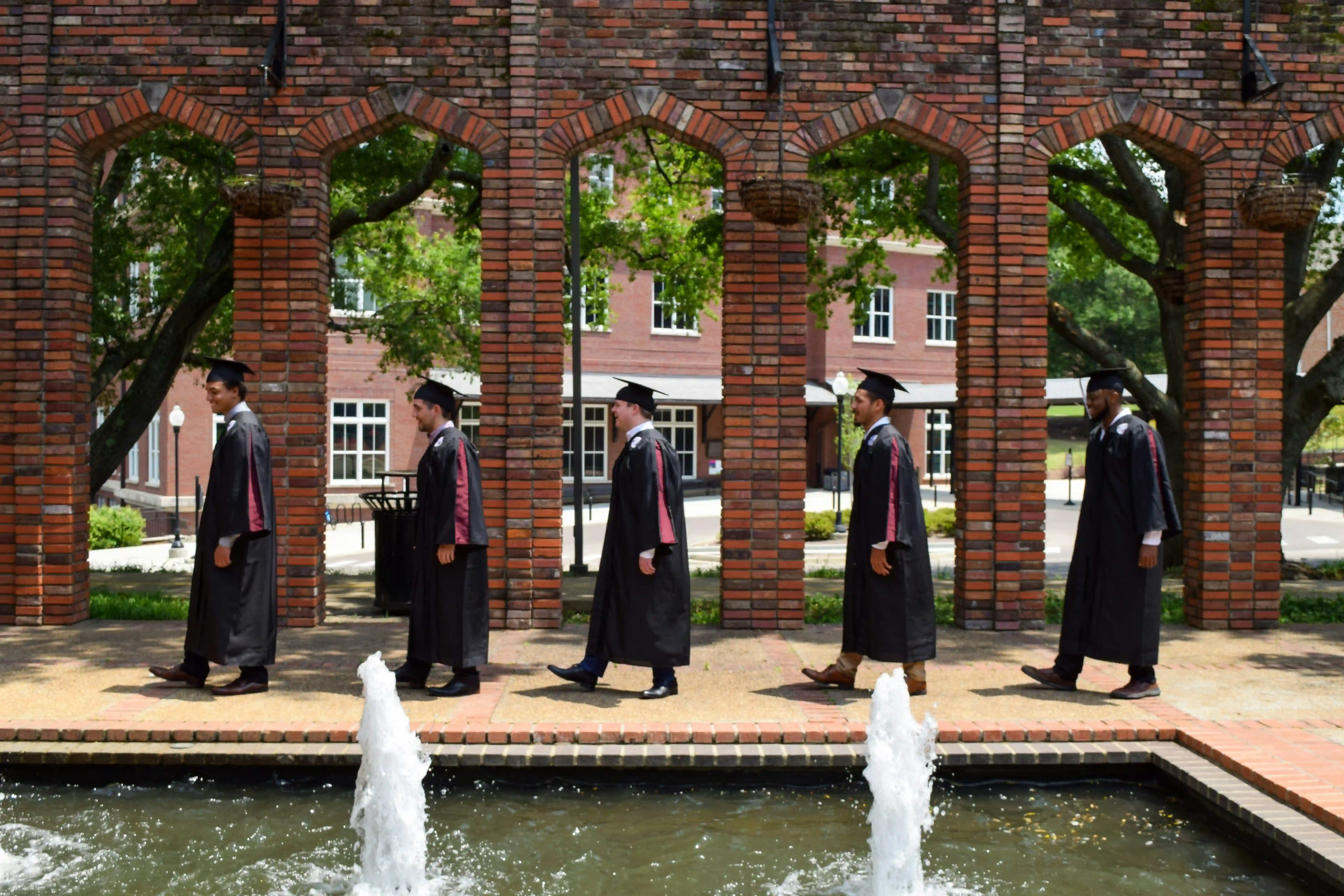 Graduates in procession representing successful completion of Canadian education