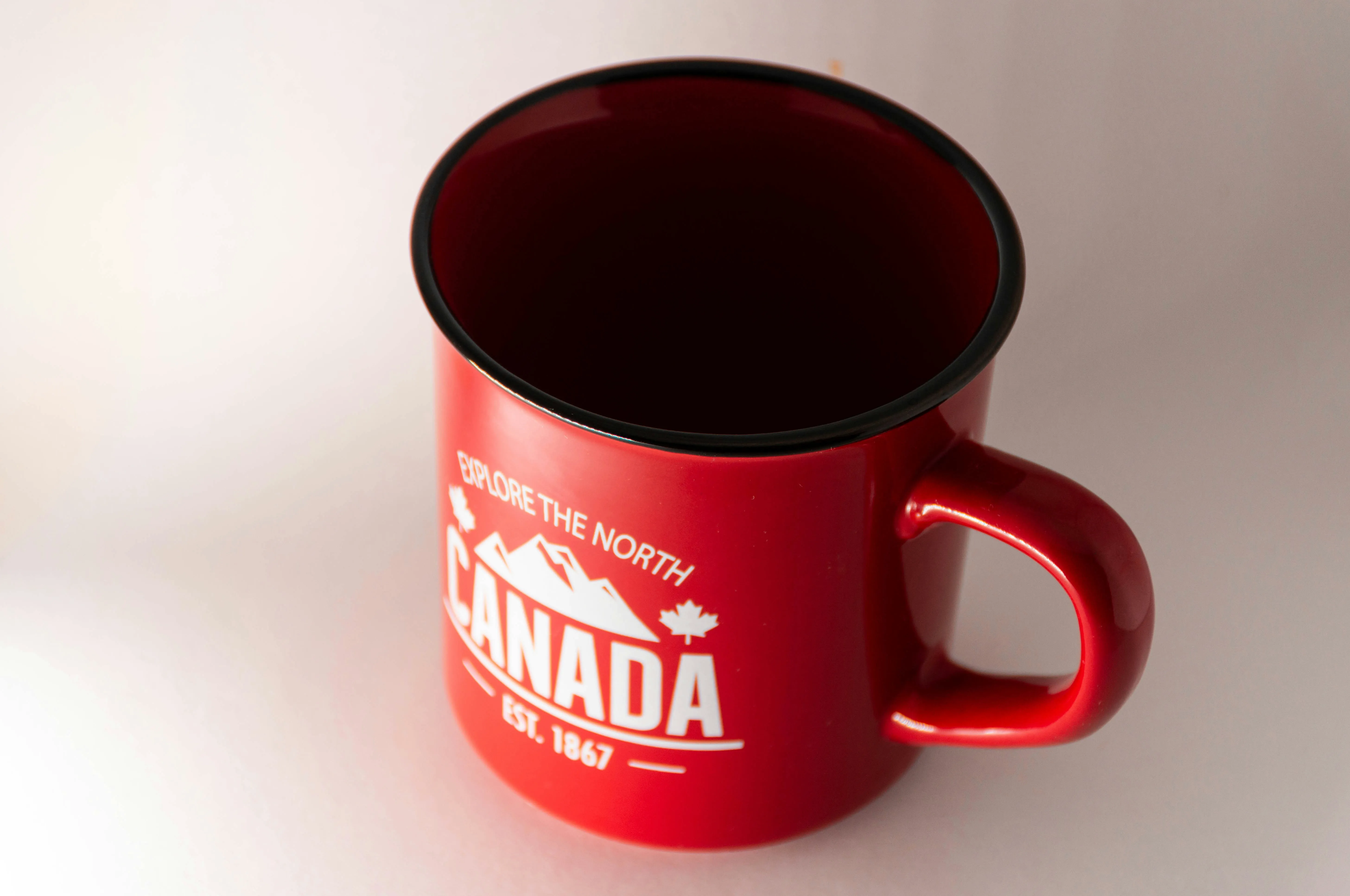 Canadian souvenir mug with maple leaf representing Canadian citizenship and identity